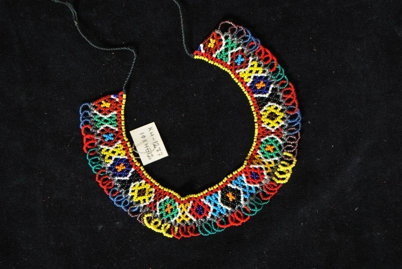 Multicoloured beaded sylianka necklace on a black background